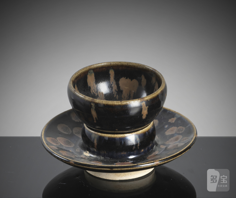 A black-glazed russet-splashed tea bowl on an associated base - 图2
